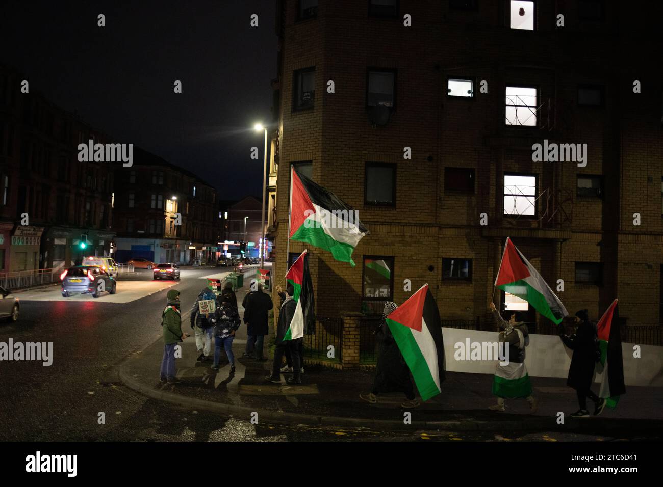 Glasgow, UK, 11th Dec 2023. Pro-Palestine walk through Linthouse area, from BAE Systems shipyard to protest outside gates of Thales weapons technology manufacturer, to protest their involvement with British military and weapons manufacturing and infrastructure, at a time of unfolding genocide in Gaza, in Glasgow, Scotland, on 11 December 2023. Photo credit: Jeremy Sutton-Hibbert/ Alamy Live News. Stock Photo