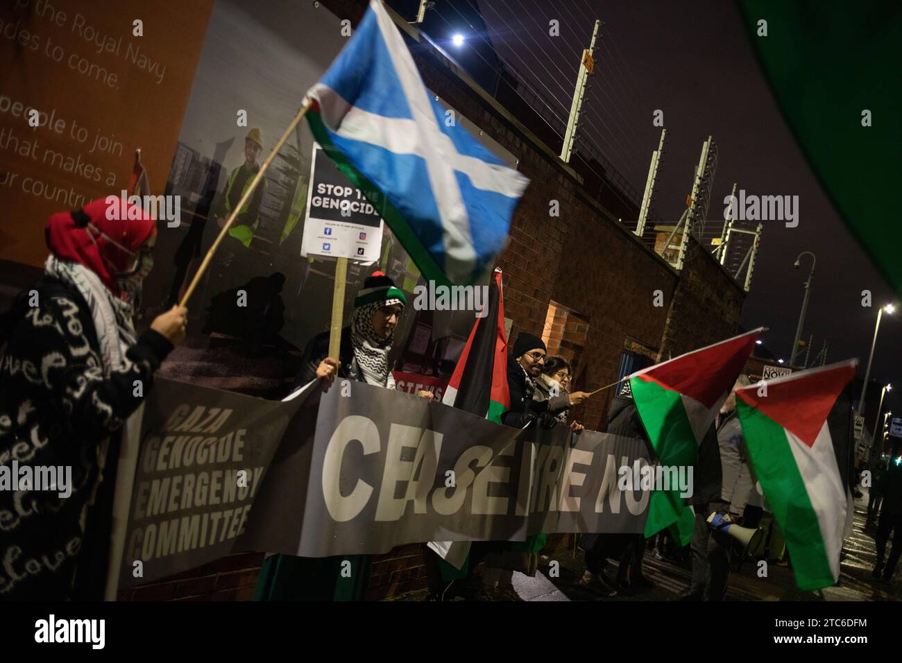 Glasgow, UK, 11th Dec 2023. Pro-Palestine rally gathers at front gate of BAE Systems in Govan to protest their involvement with British navy and military infrastructure, at a time of unfolding genocide in Gaza, in Glasgow, Scotland, on 11 December 2023. Photo credit: Jeremy Sutton-Hibbert/ Alamy Live News. Stock Photo