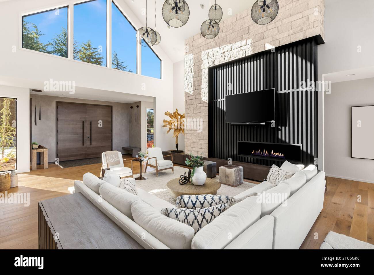 Living room and foyer in new contemporary style luxury home Stock Photo ...