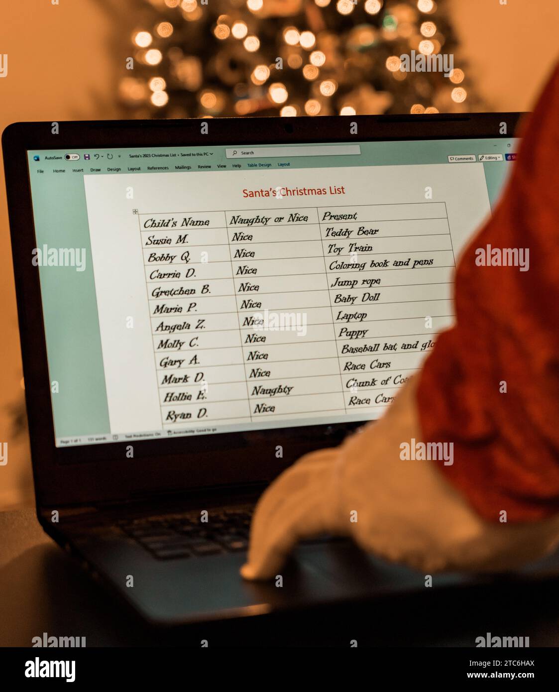 Santa checking his list online twice Stock Photo - Alamy