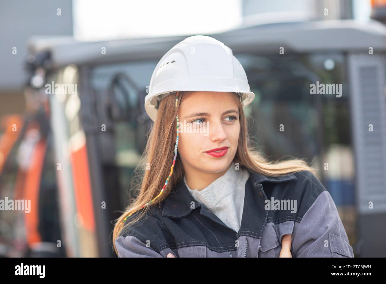 Young engineer female with helmet watching Stock Photo