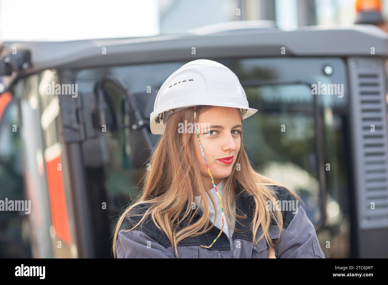 Young engineer female with helmet watching Stock Photo