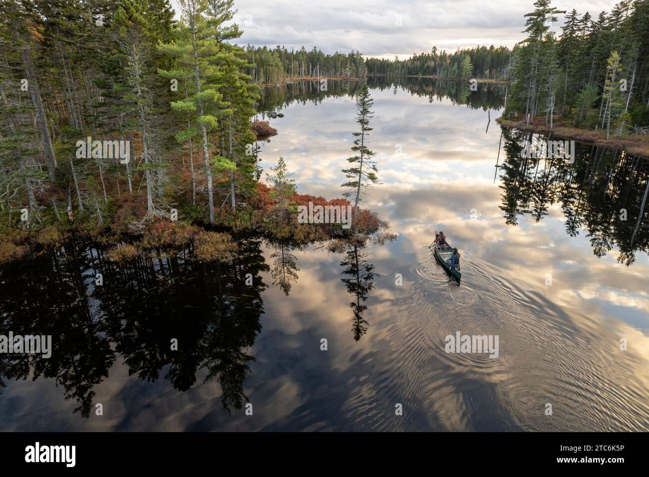 Couple canoes on lake near Katahdin Woods and Waters monument Stock