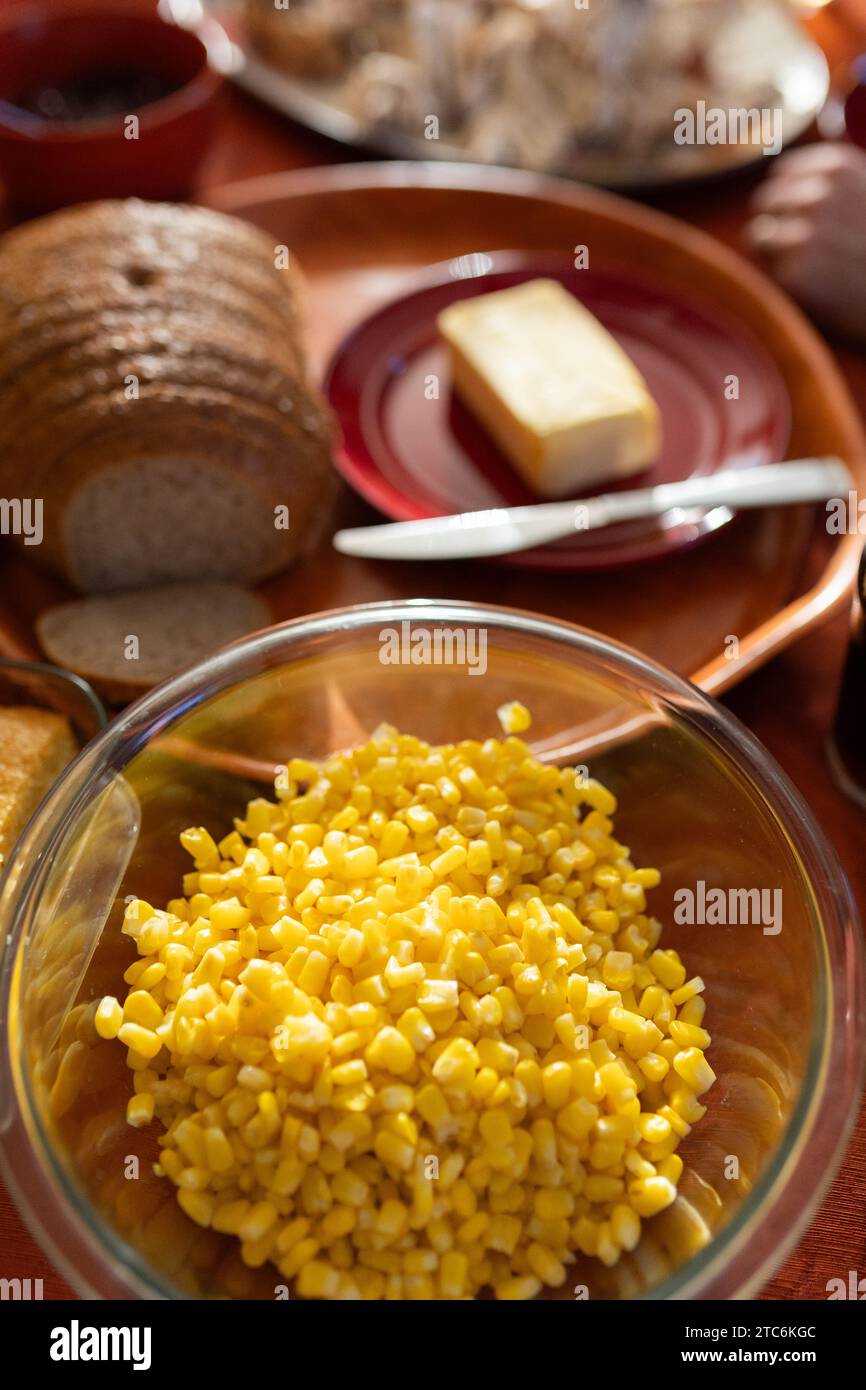 thanksgiving table of food with bread and butter and corn Stock Photo