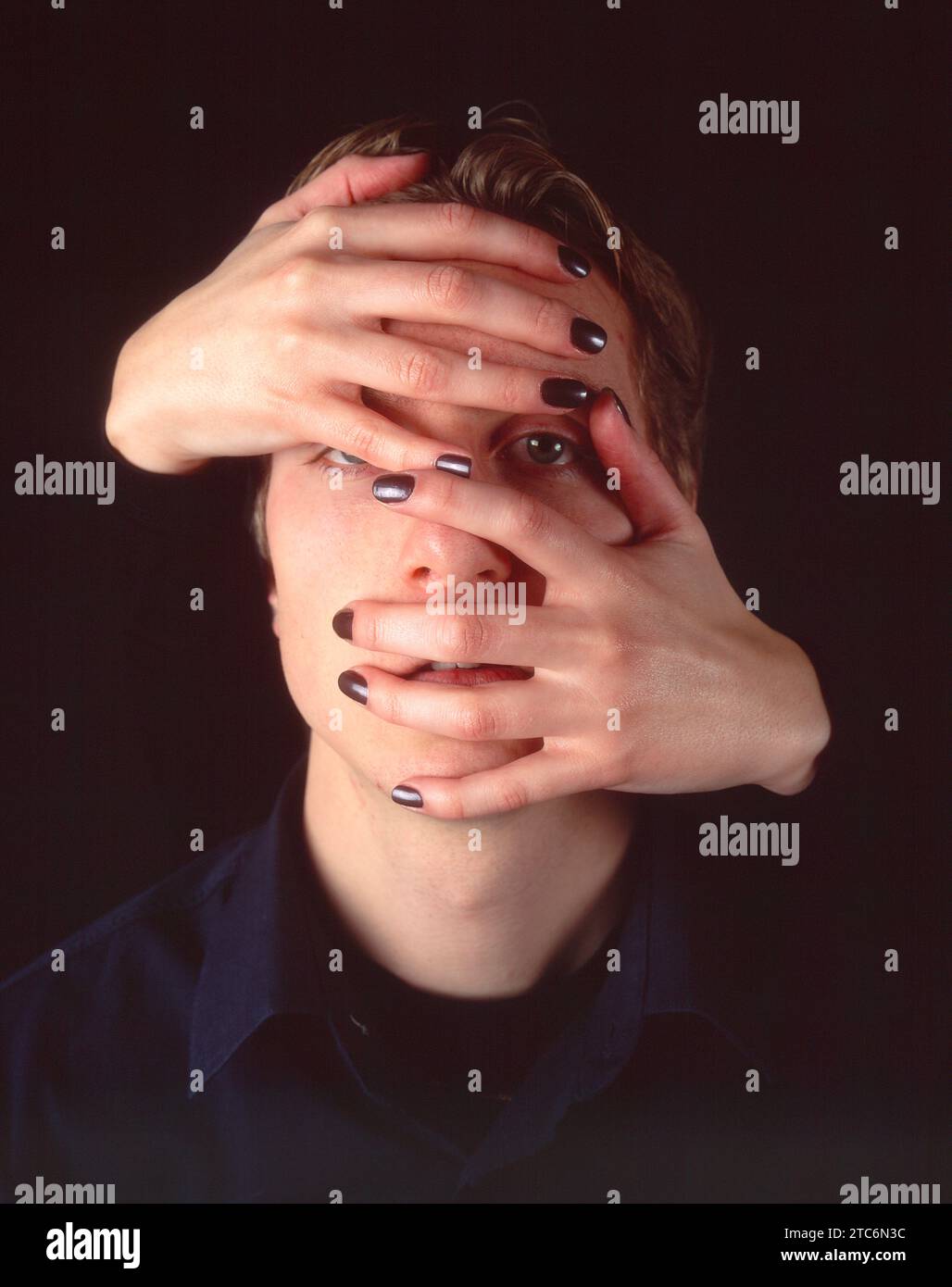 Hands covering face Stock Photo