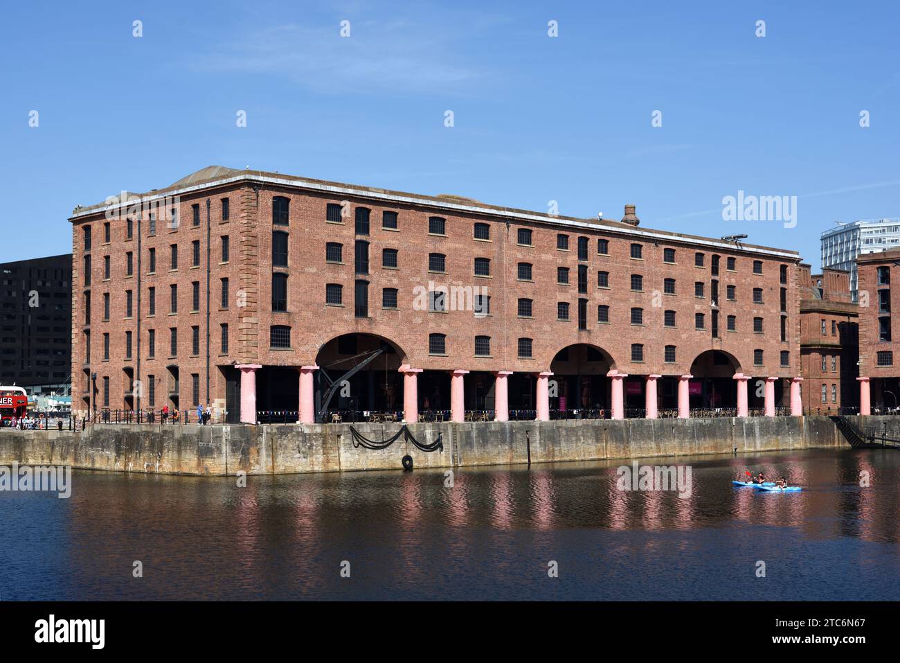 Canoeing in Royal Albert Dock (1846) Historic Dock Buildings & Warehouses designed by Jesse Hartley & Philip Hardwick on Pier Head Liverpool Stock Photo