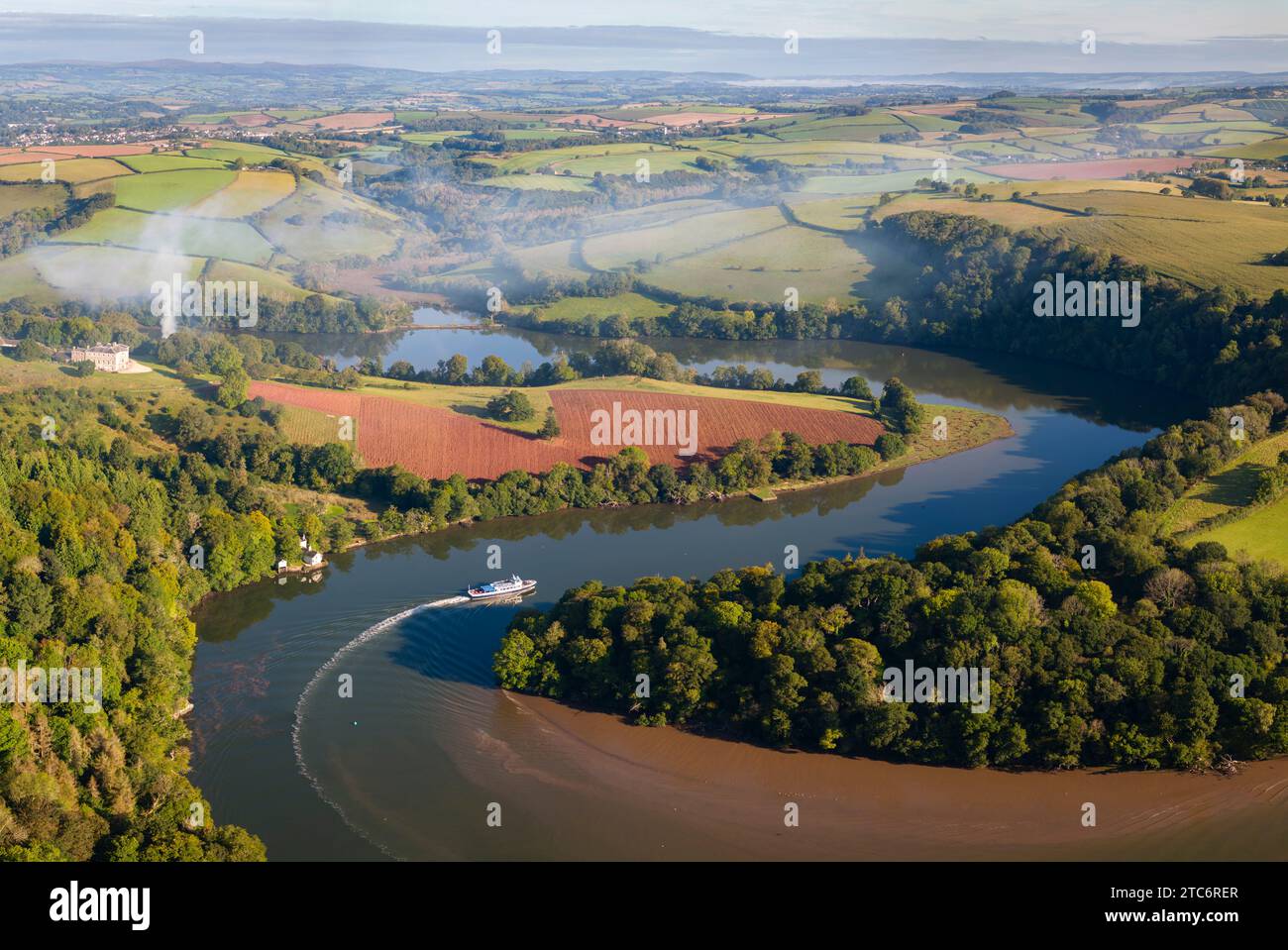 Aerial view of a tourist riverboat cruising up the meandering River Dart towards Totnes, Devon, England.  Autumn (September) 2023. Stock Photo