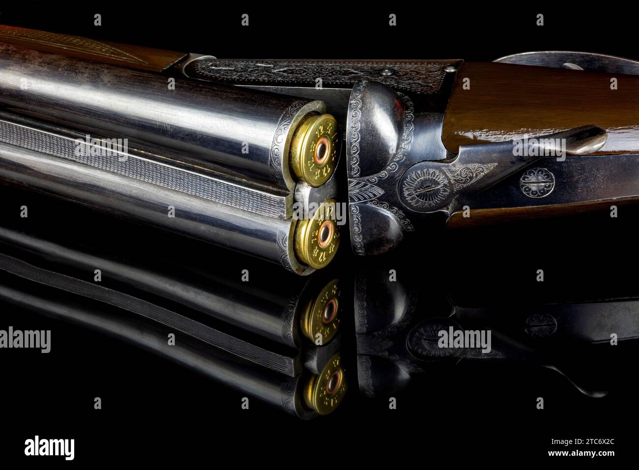 Vintage double barrel side by side shotgun with cartridges on a