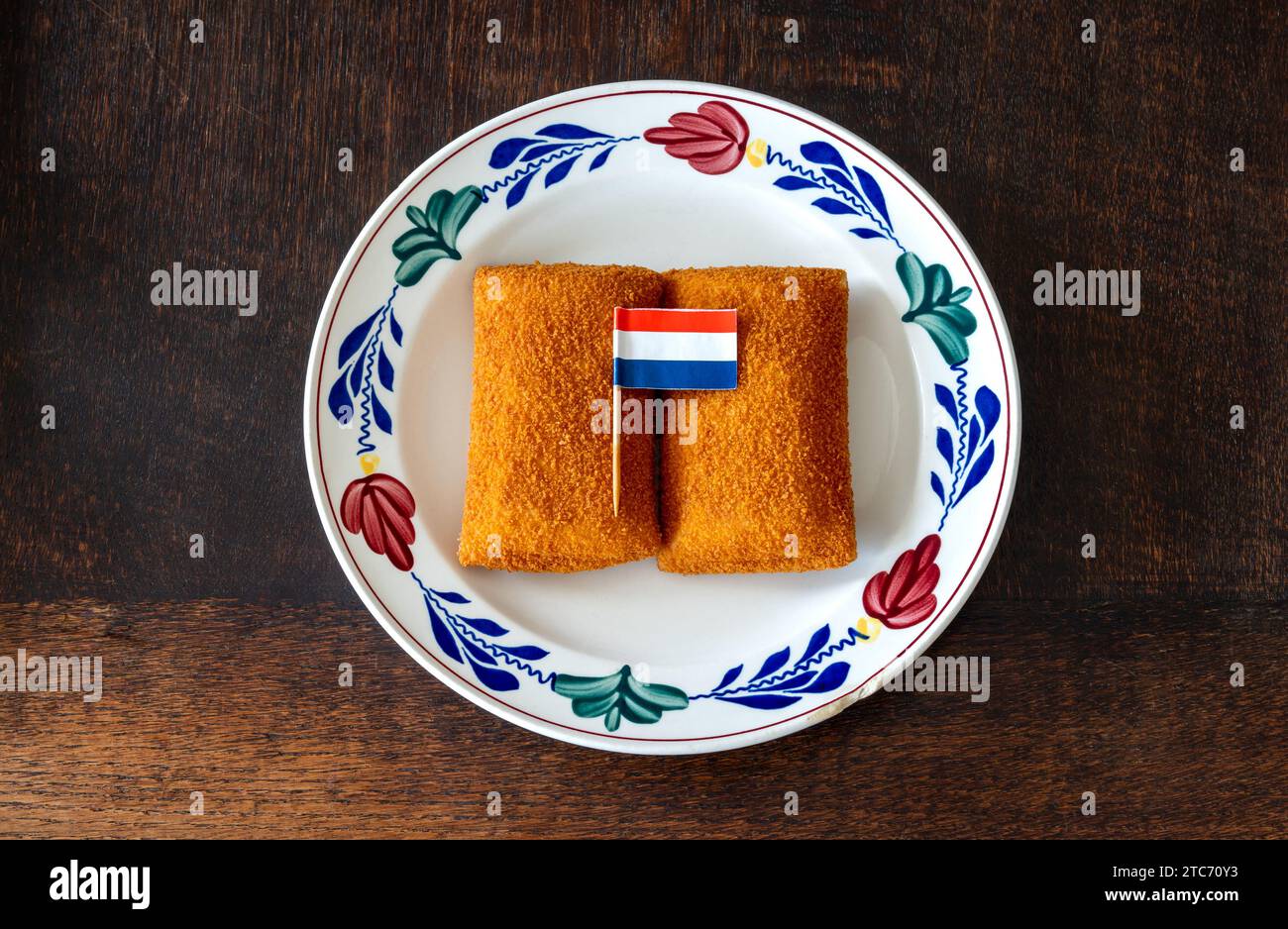 Kaassouffle on the plate with dutch flag, a popular fast food snack consisting of melted cheese inside a breaded and deep fried wrap Stock Photo