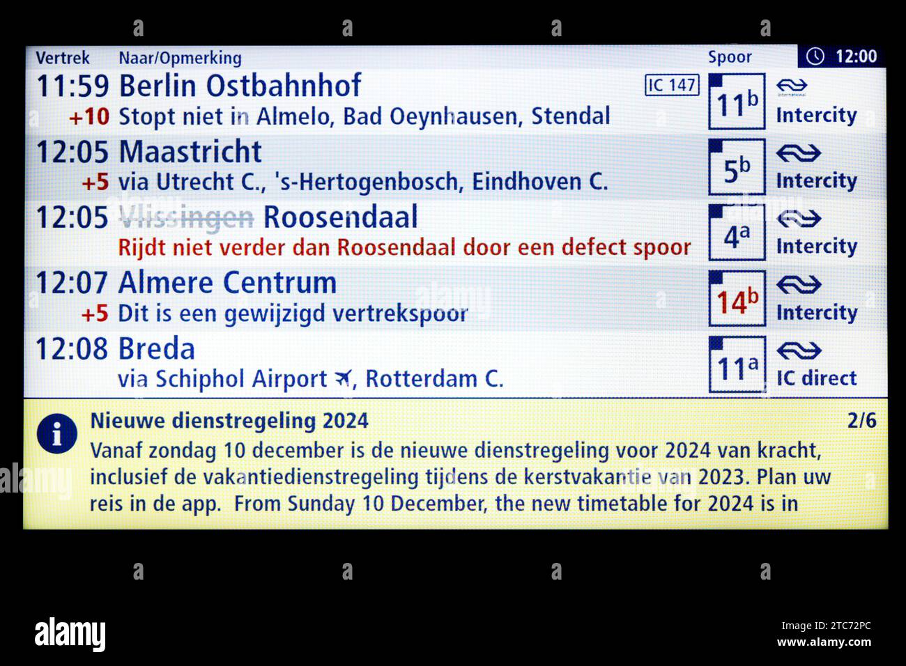 AMSTERDAM - A sign with arrival and departure times at Amsterdam Central station. The new NS timetable has come into effect. For example, more intercity trains run between the major cities and the Intercity Direct between Amsterdam and Breda runs all day long. ANP RAMON VAN FLYMEN netherlands out - belgium out Stock Photo