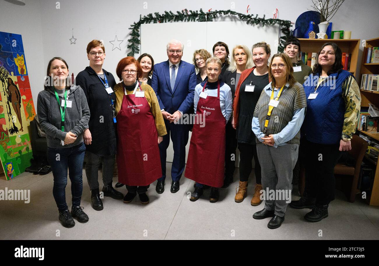 Berlin, Germany. 11th Dec, 2023. Federal President Frank-Walter Steinmeier (center l) visits the support facilities for women 'Housing First' and 'Eva's Haltestelle' of the Sozialdienst katholischer Frauen e.V. in Berlin-Wedding and stands together with employees of the projects for a group photo. Credit: Bernd von Jutrczenka/dpa/Alamy Live News Stock Photo