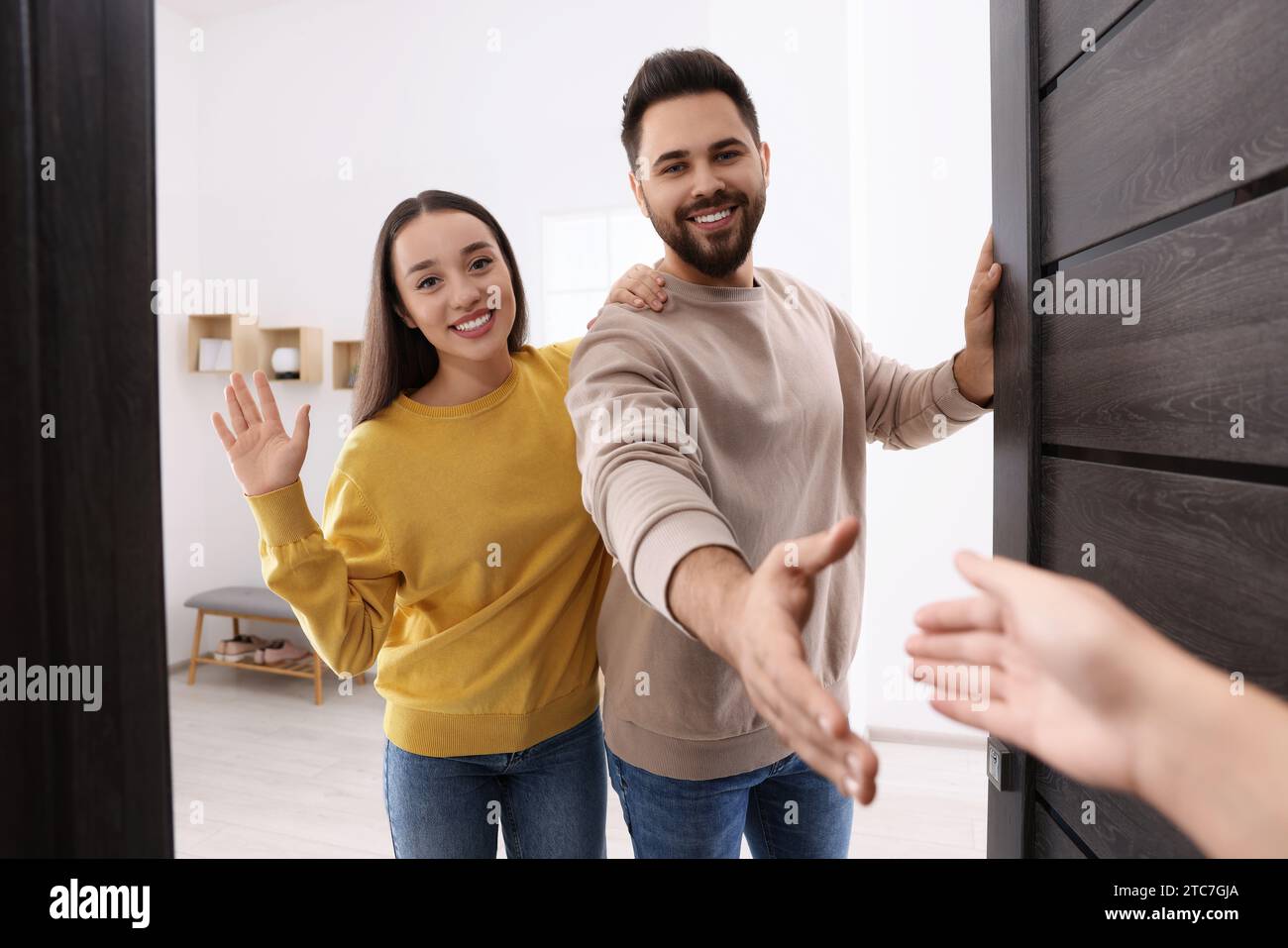 Welcoming man waving hand hello hi-res stock photography and images - Alamy