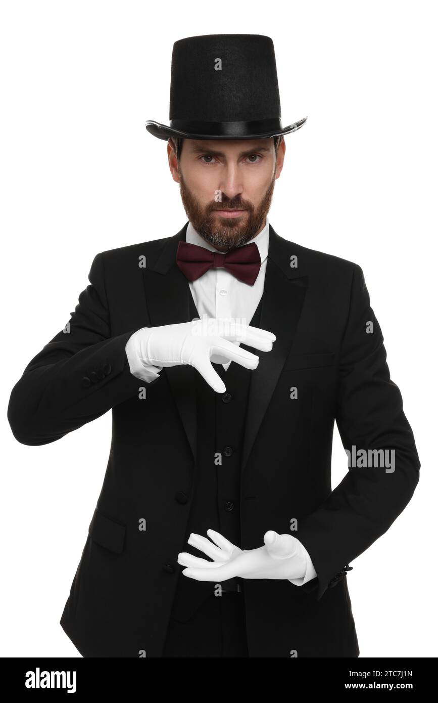 Magician in top hat holding something on white background Stock Photo ...