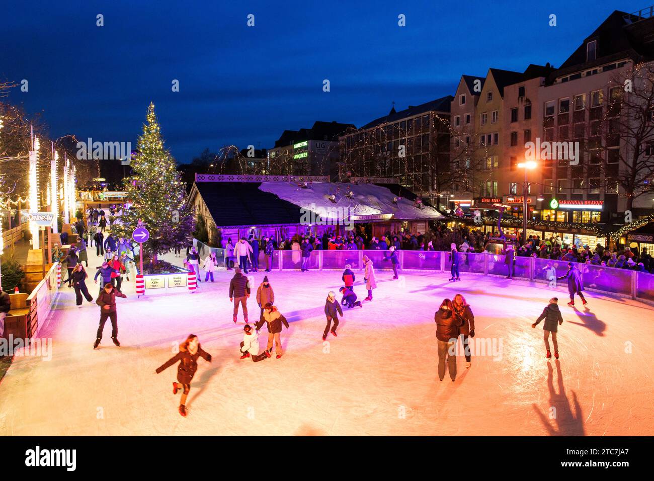 ice skating rink on the Christmas market at the Heumarkt in the historic town, Cologne, Germany. Eislaufbahn auf dem Weihnachtsmarkt am Heumarkt in de Stock Photo
