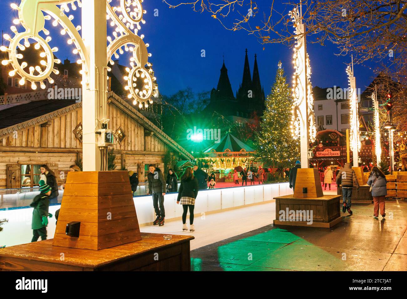 ice skating rink on the Christmas market at the Heumarkt in the historic town, view to the cathedral, Cologne, Germany. Eislaufbahn auf dem Weihnachts Stock Photo