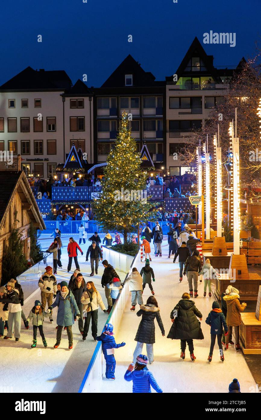 ice skating rink on the Christmas market at the Heumarkt in the historic town, Cologne, Germany. Eislaufbahn auf dem Weihnachtsmarkt am Heumarkt in de Stock Photo