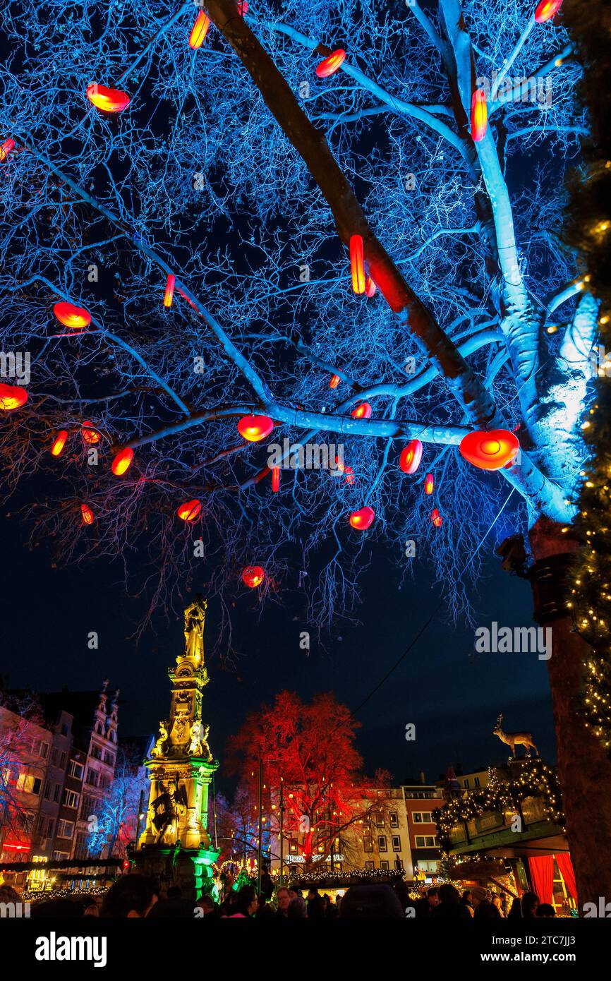 the Christmas market Heinzels Wintermaerchen at the Old Market in the historic town, illuminated tree with hearts, Jan von Werth fountain, Cologne, Ge Stock Photo