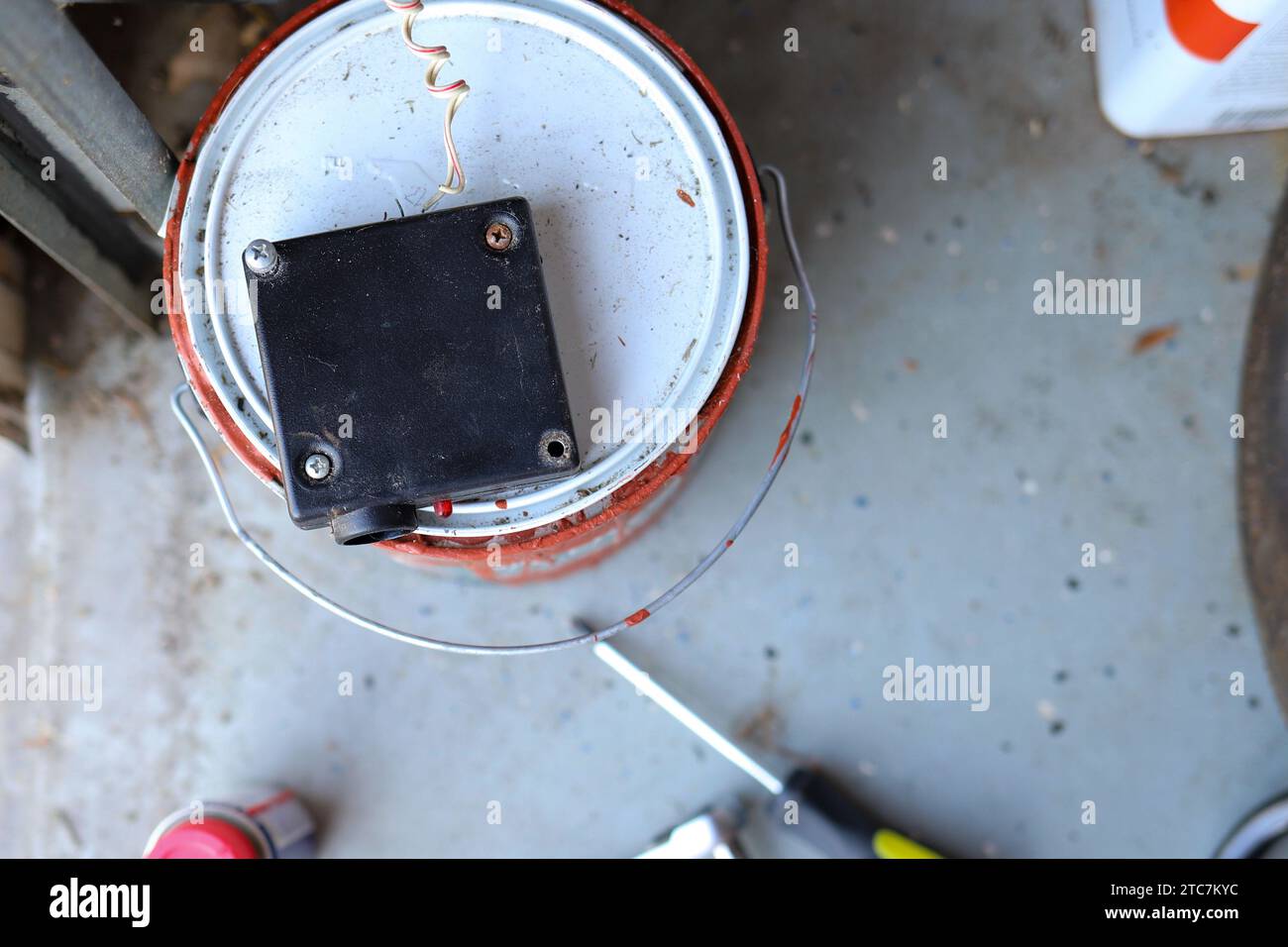 Close up of a broken garage door photo eye sensor Stock Photo Alamy
