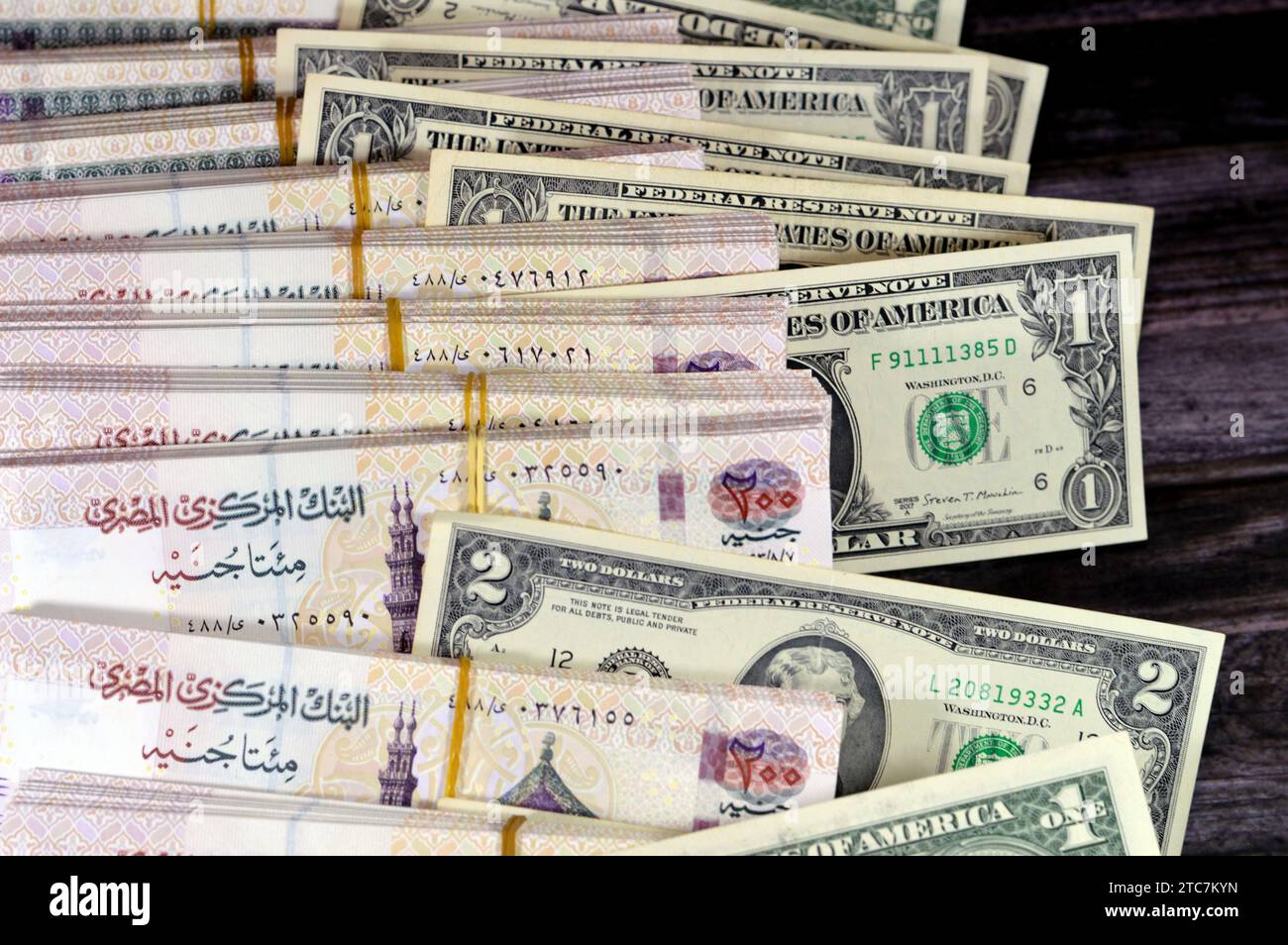 piles-and-stacks-of-egypt-money-thousands-of-pounds-currency-banknotes-bills-of-200-egp-le-egyptian-money-exchange-rate-and-usa-american-dollars-ban-2TC7KYN.jpg