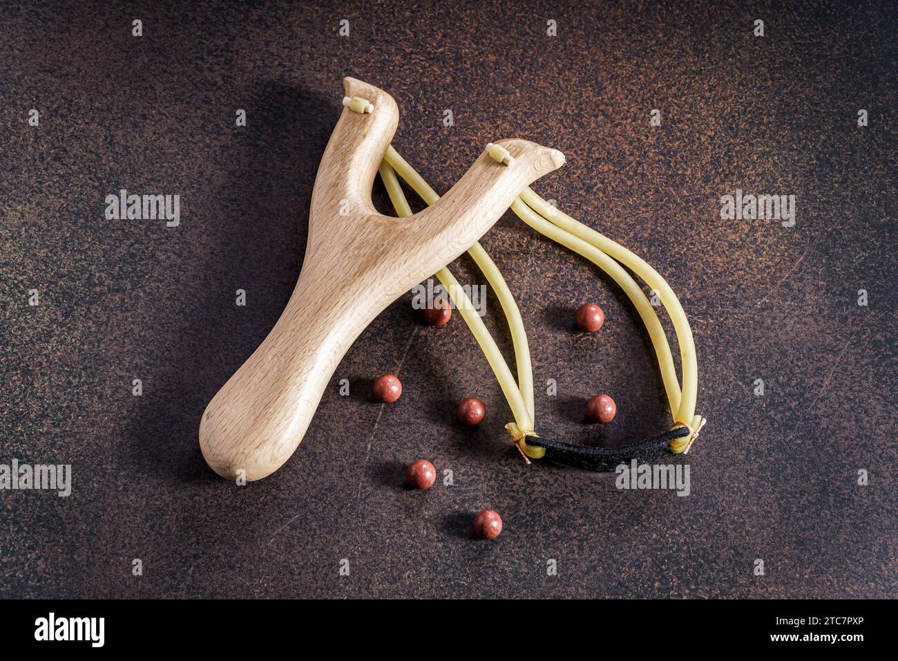 Wooden slingshot with balls Stock Photo