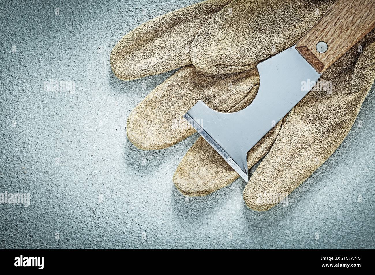 Plastering trowel protective gloves on concrete surface construction concept Stock Photo