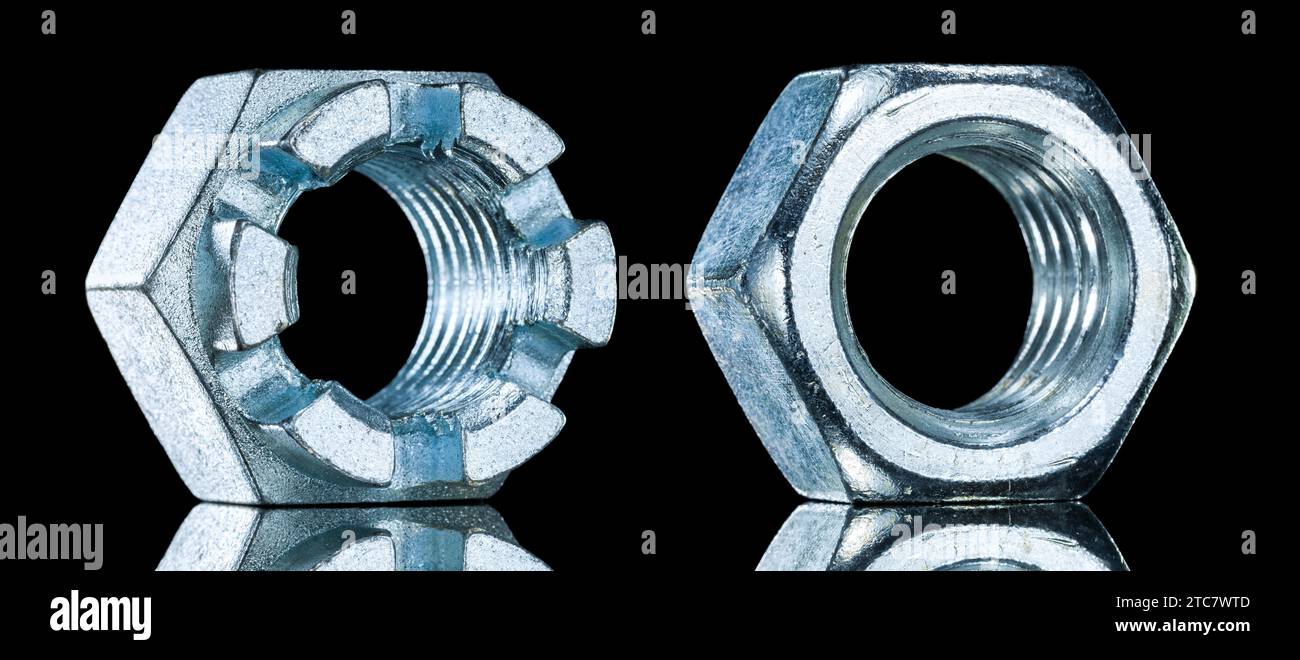 Stainless crown nuts on black background Stock Photo - Alamy