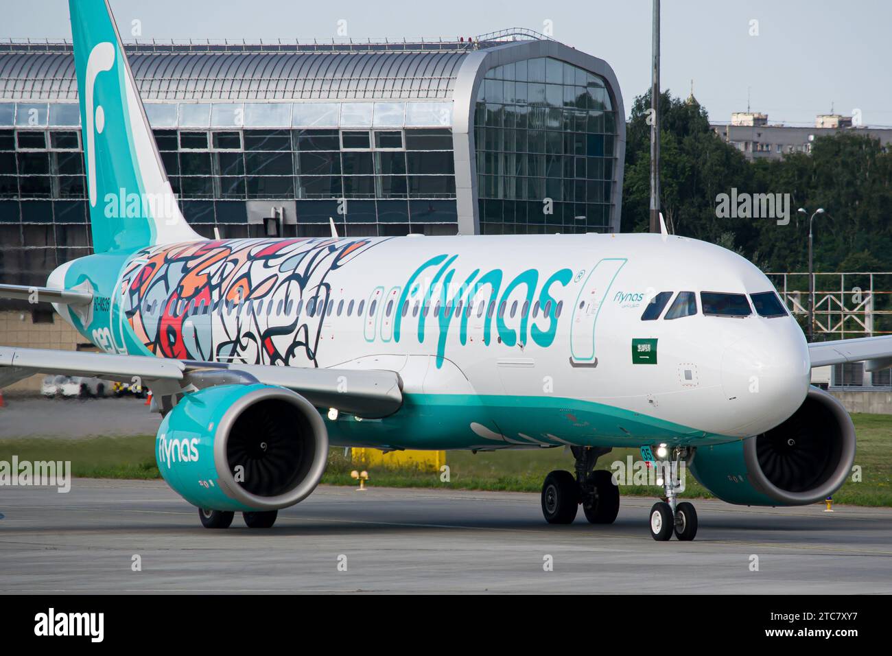 Close-up of a Saudi airline's Flynas Airbus A320 NEO in a 'Year of Arabic Calligraphy' livery taxiing for takeoff from Lviv Airport Stock Photo