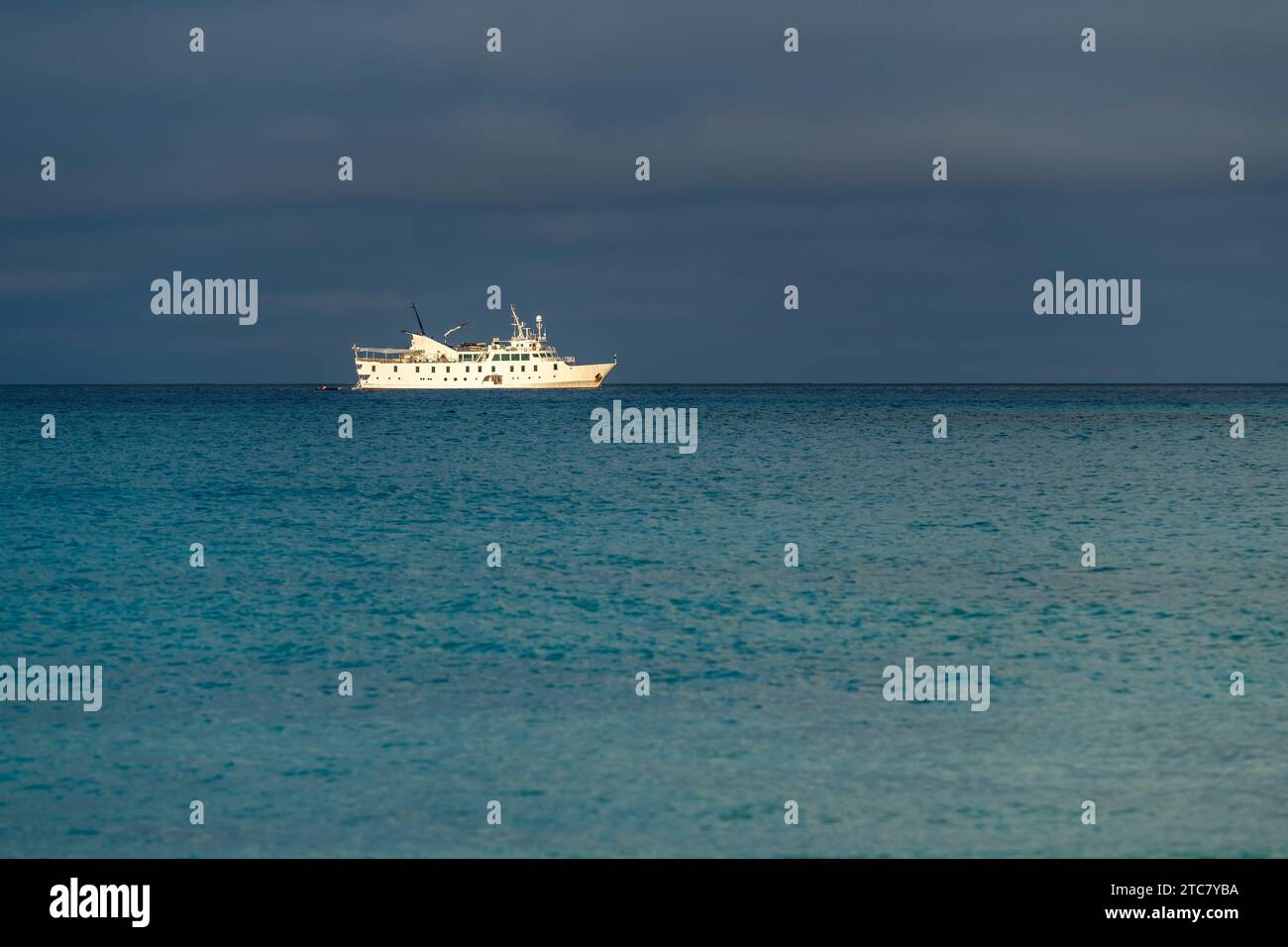 Cruise ship at anchor by Gardner Bay, Espanola Island, Galapagos national park, Ecuador. Stock Photo