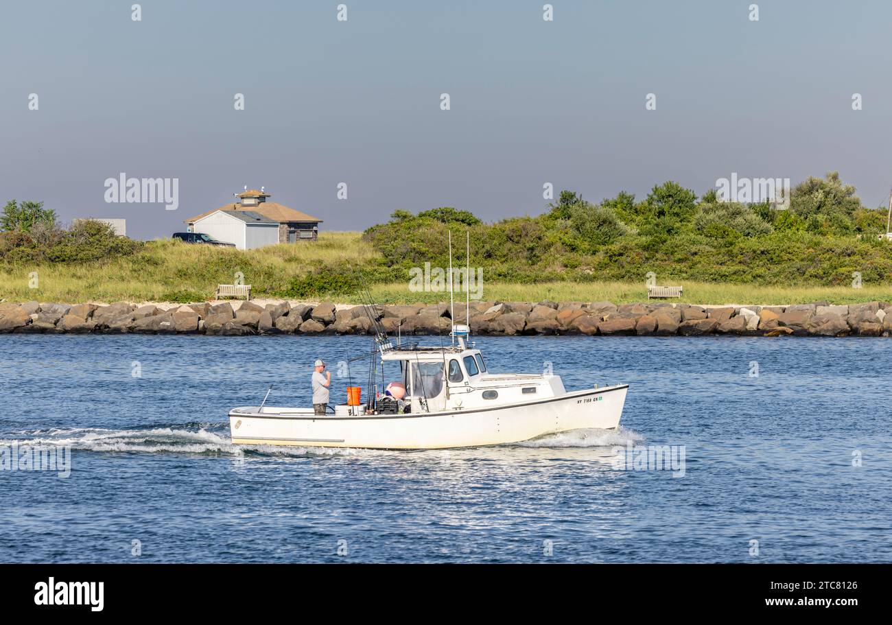 small fishing vessel ila anne returning to Montauk Harbor Stock Photo