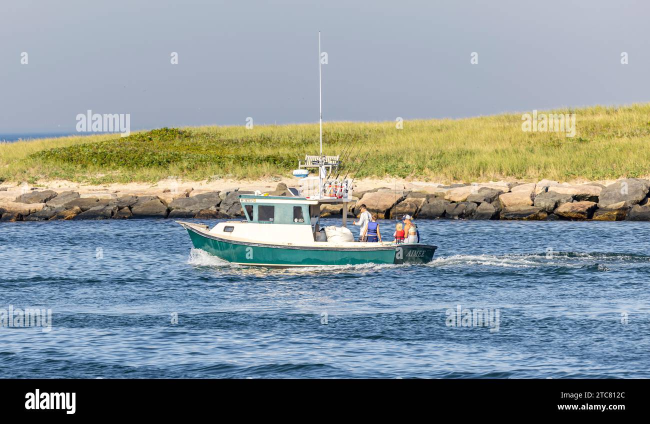 power boat heading out of montauk inlet Stock Photo