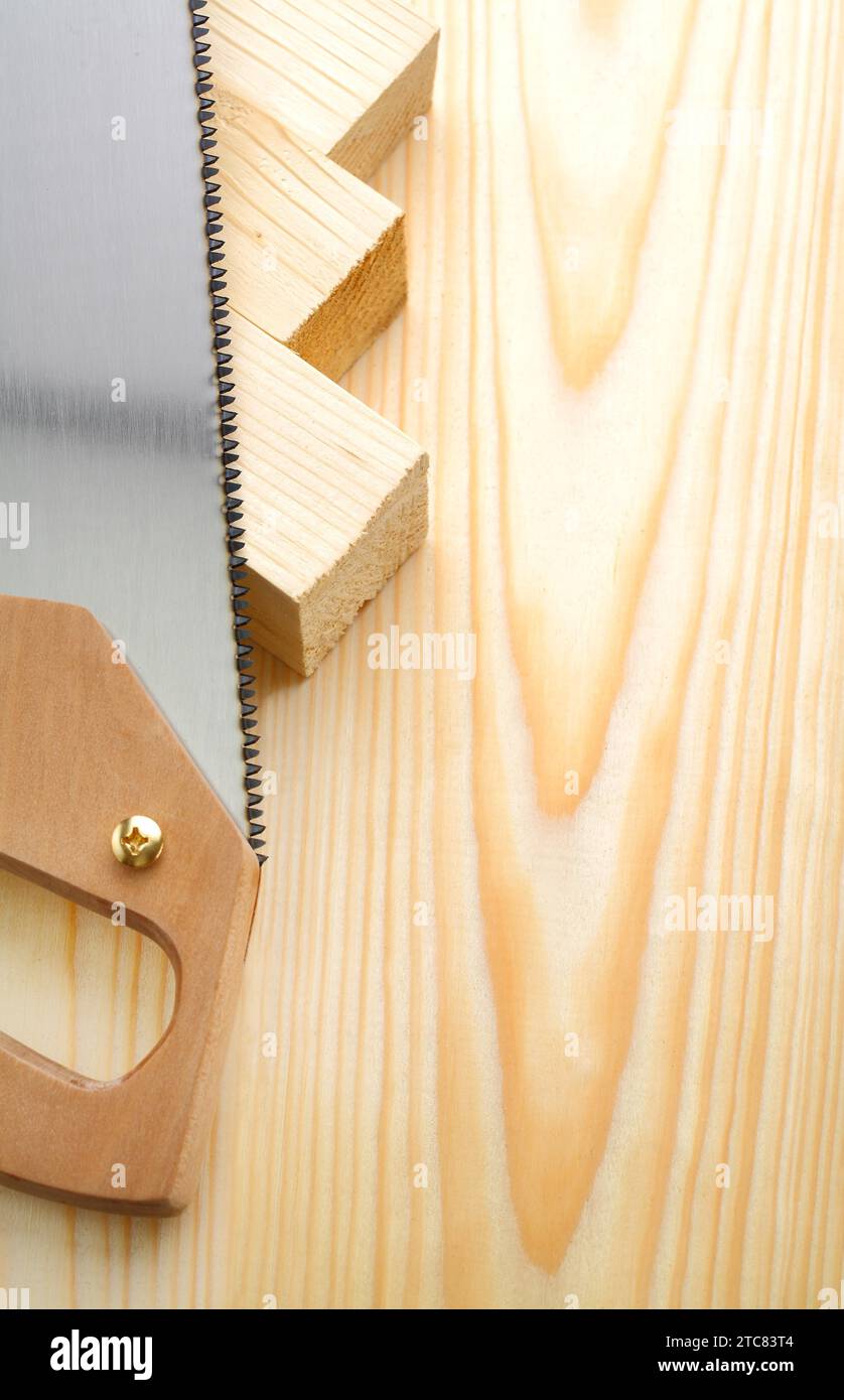 Copyspace image handsaw and timber Stock Photo
