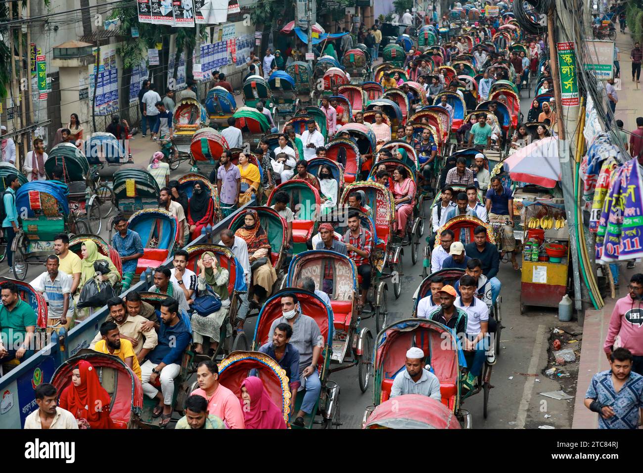 Hundreds of rickshaws are stuck in a traffic jam in Dhaka, Bangladesh, December 6, 2023. Every year high number of non-motorized illegal rickshaws on Stock Photo