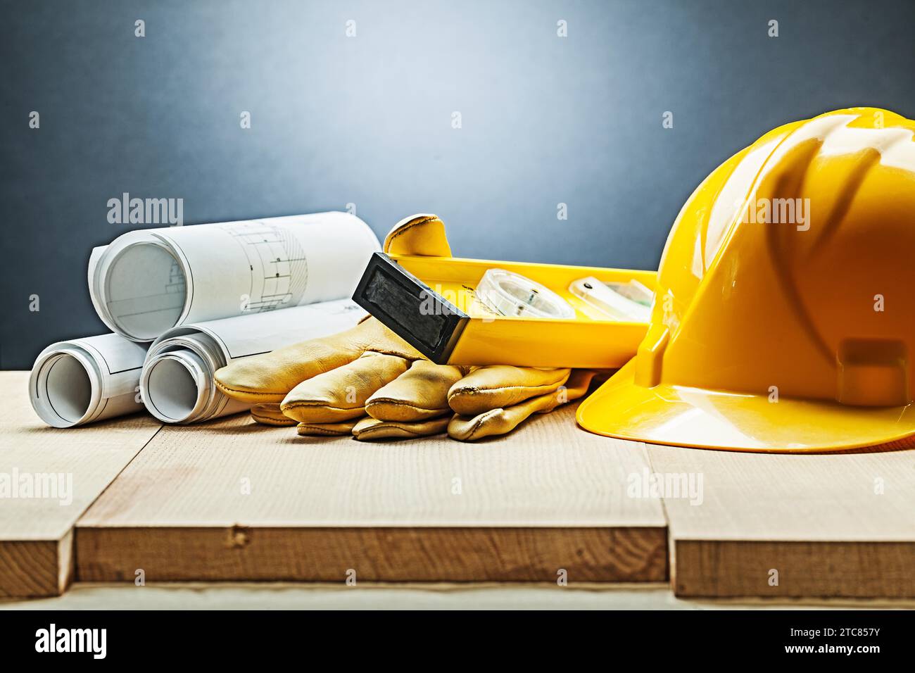 Construction blueprints gloves level helmet Stock Photo