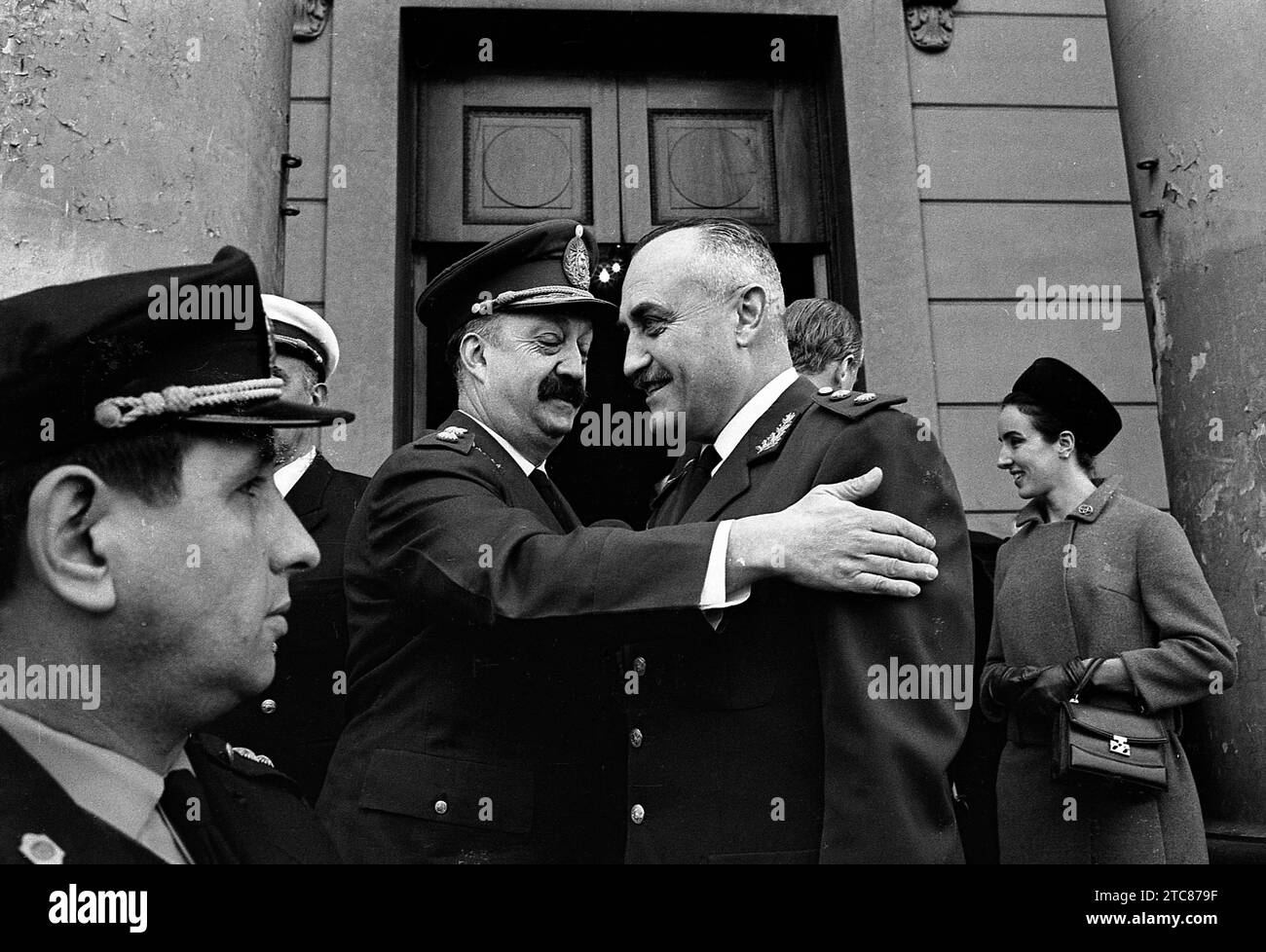 Argentine General Osiris Guillermo Villegas (center left) greets an unidentified military wihout cap at the entrance of the Buenos Aires Metropolitan Cathedral, July 1st, 1968. Stock Photo