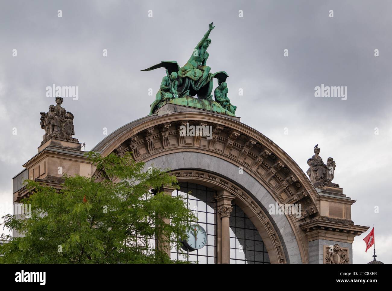 A picture of the Torbogen Lucerne monument in front of the Lucerne Train Station Stock Photo