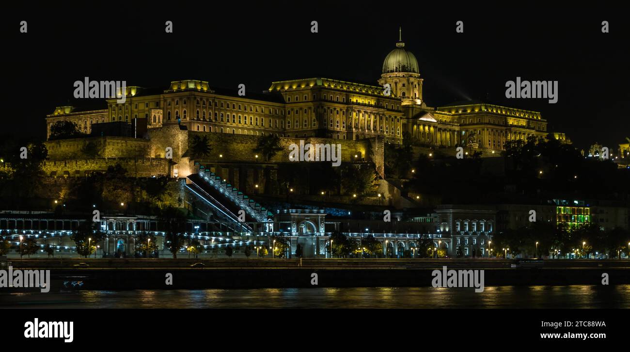 A picture of Buda Castle at night, as seen from the opposite margin of the Danube river Stock Photo
