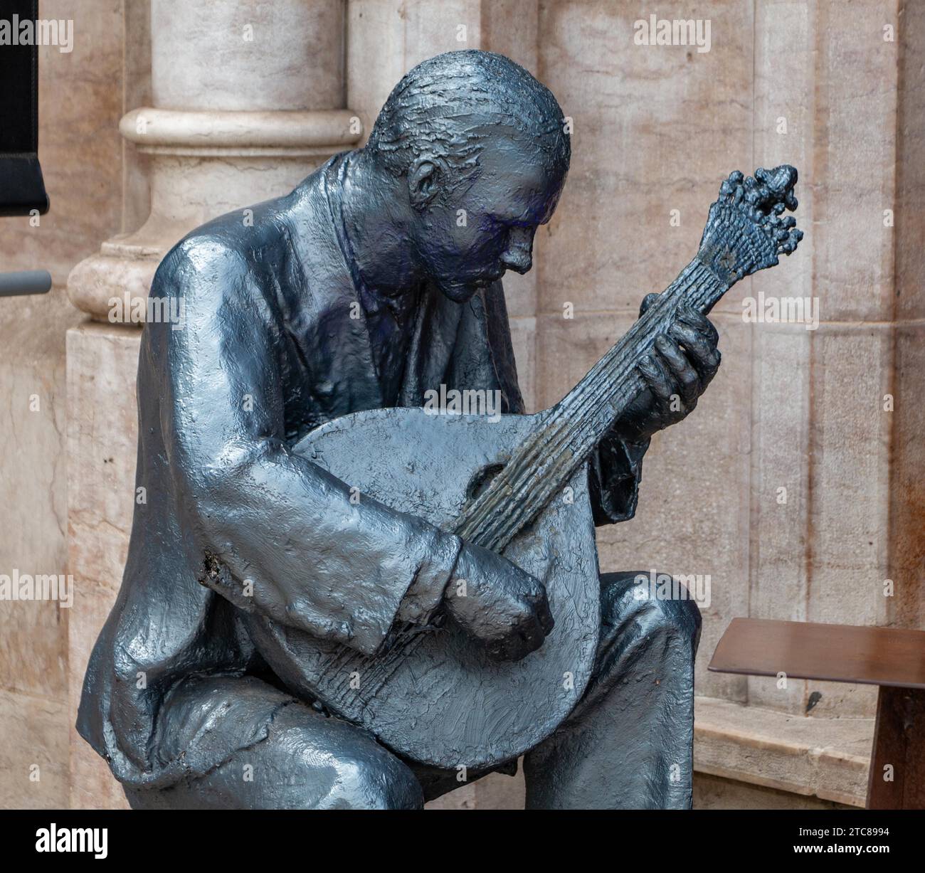 A picture of a sculpture showing a Portuguese guitar player, representing the Fado music genre, traditional of Portugal (Lisbon) Stock Photo
