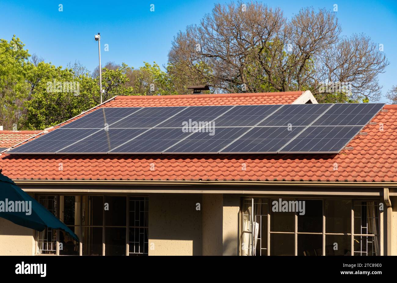 Solar panels, aimed at mitigating 'load-shedding' or blackouts, are seen on a residential roof in a suburb of Johannesburg, South Africa Stock Photo