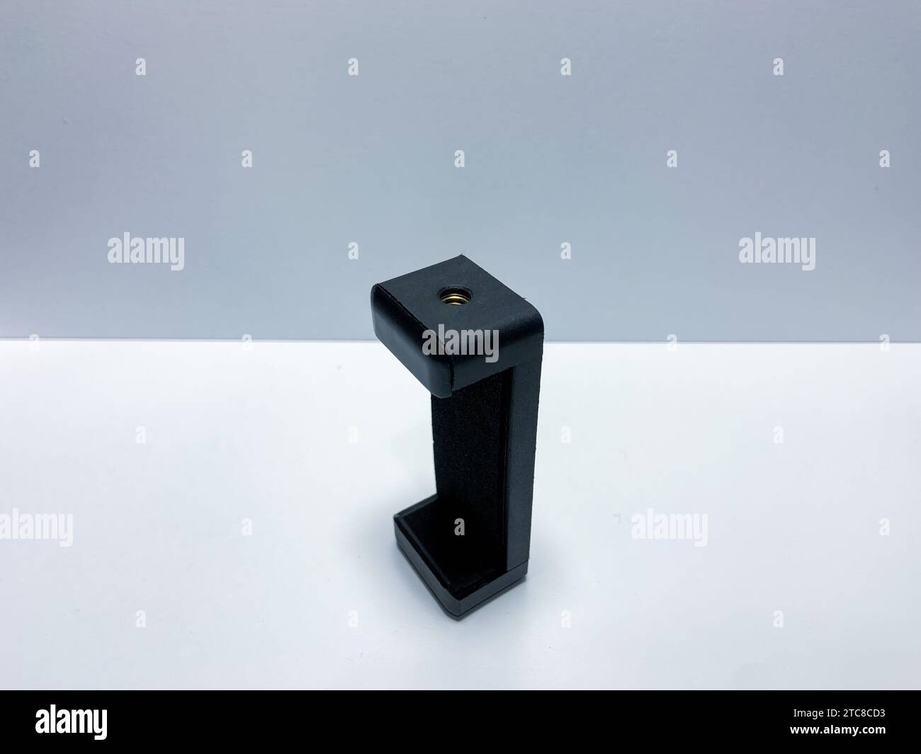 The phone holder is black on a white background Stock Photo