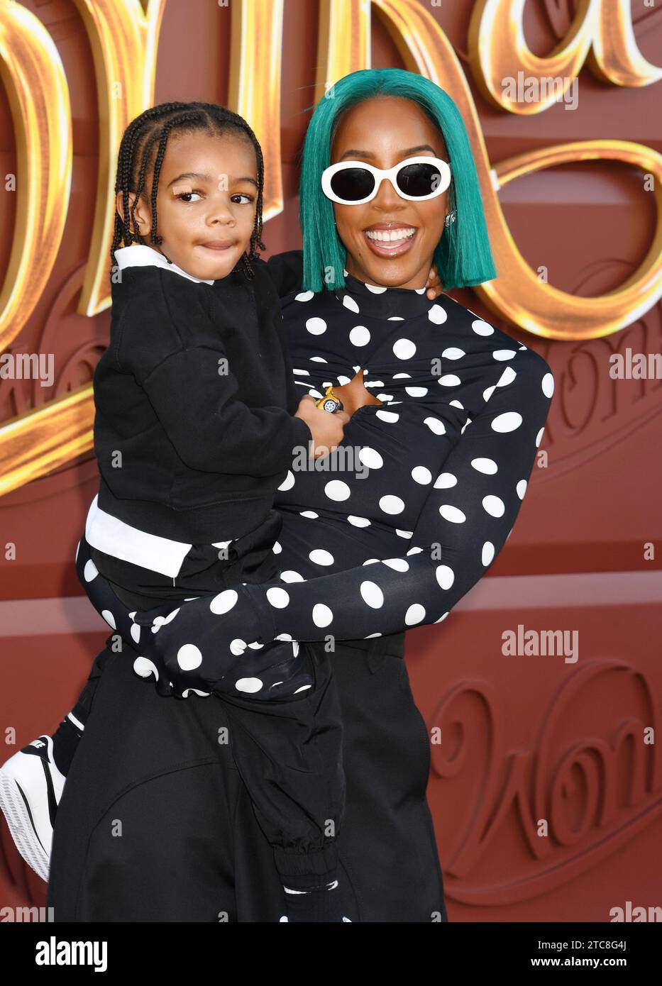 LOS ANGELES, CALIFORNIA - DECEMBER 10: Kelly Rowland (R) and Noah Jon Weatherspoon attend the Los Angeles Premiere of Warner Bros. 'Wonka' at Regency Stock Photo