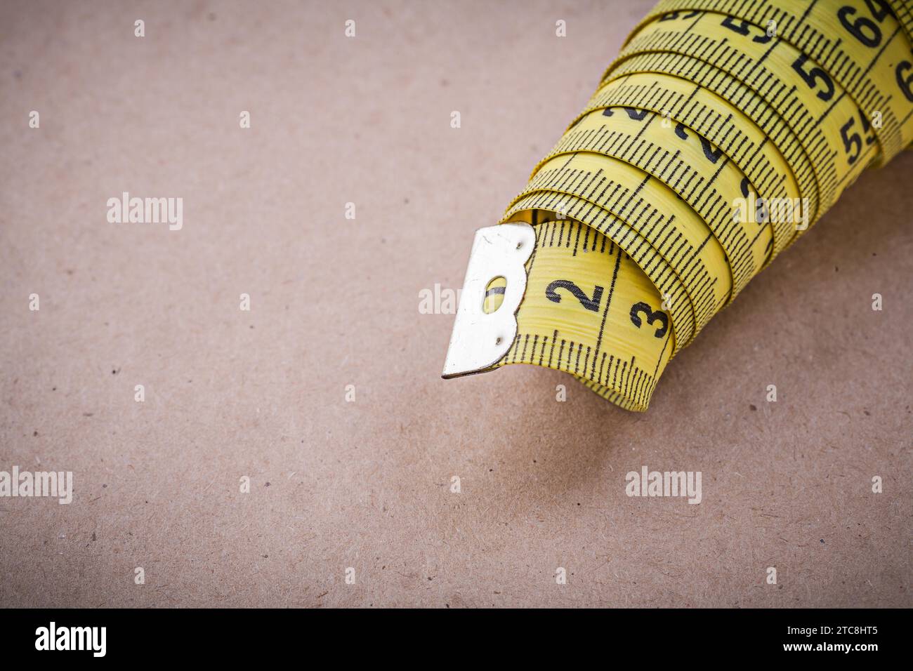 Yellow flexible tape measure Stock Photo - Alamy