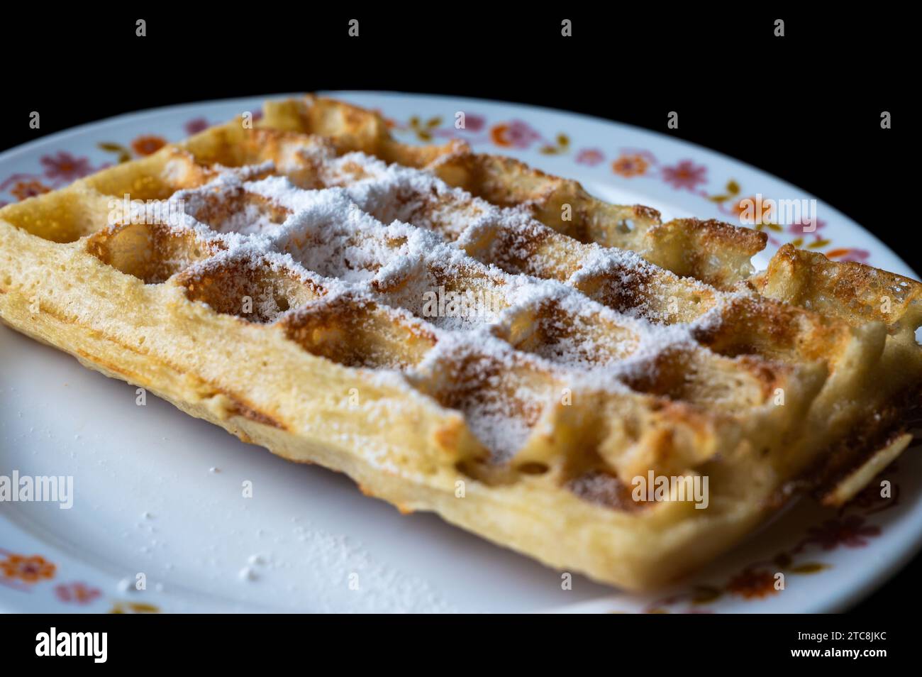 Close up of fresh home made Brussels Waffles covered with icing sugar, Brussels, Belgium Stock Photo