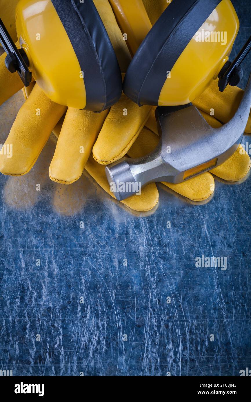 Set of safety workwear on scratched metallic background construction concept Stock Photo