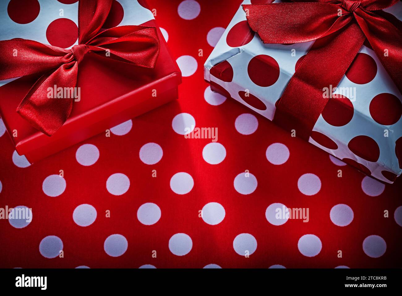 Gift boxes on polka-dot red print background holidays concept Stock ...