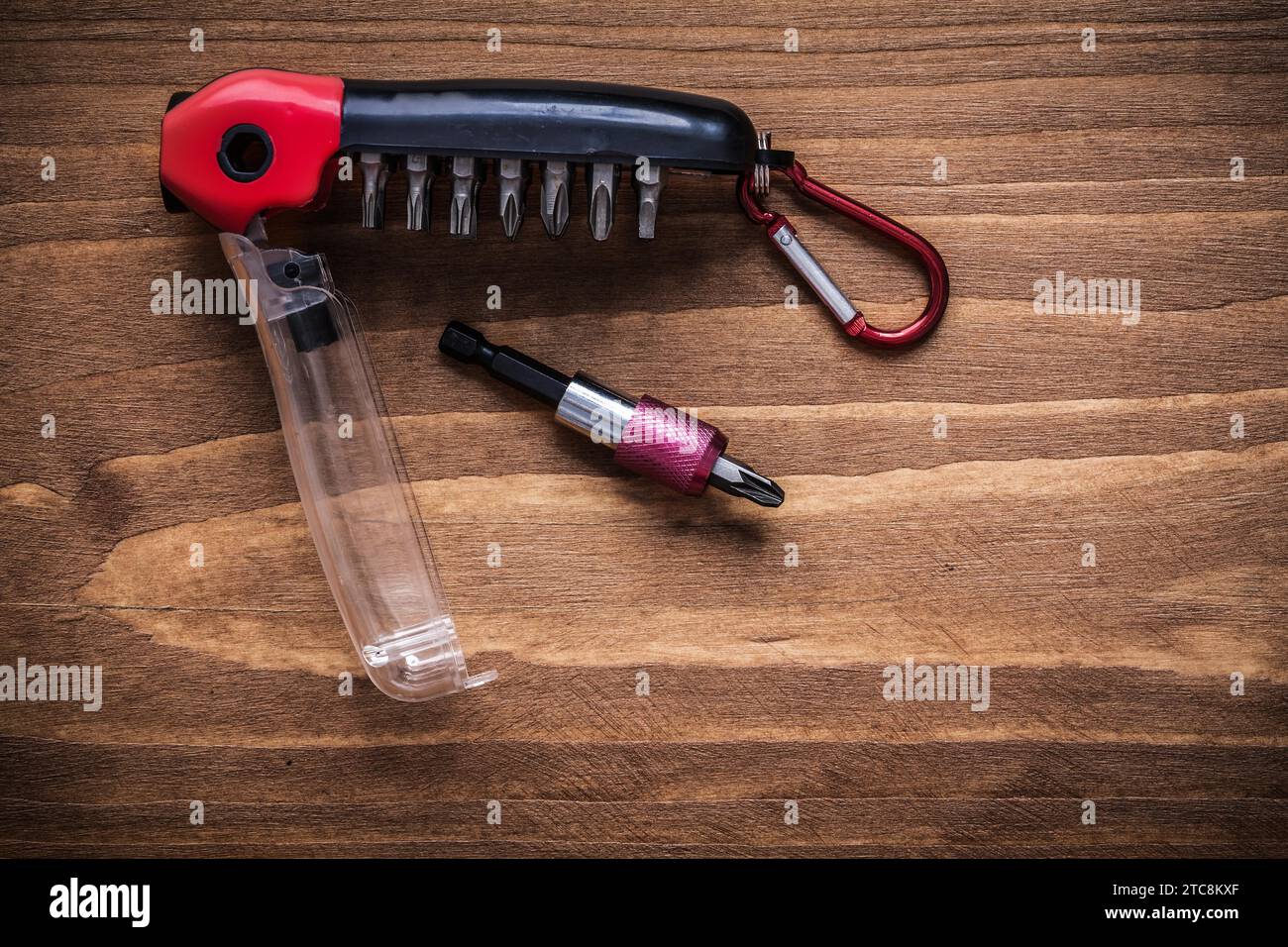 Interchangeable turnscrew bits in toolbox on wood board construction concept Stock Photo