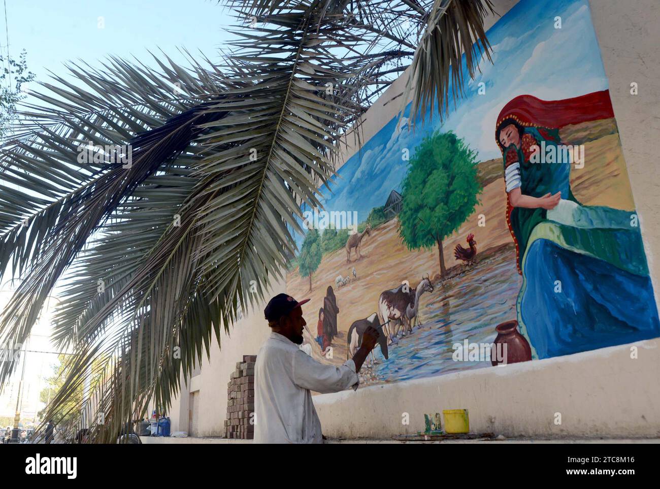 Fine artists busy in painting on walls to show their skills for the beautification of city, under supervision of local government department, located on I.I Chundrigar road in Karachi on Monday, December 11, 2023. Stock Photo