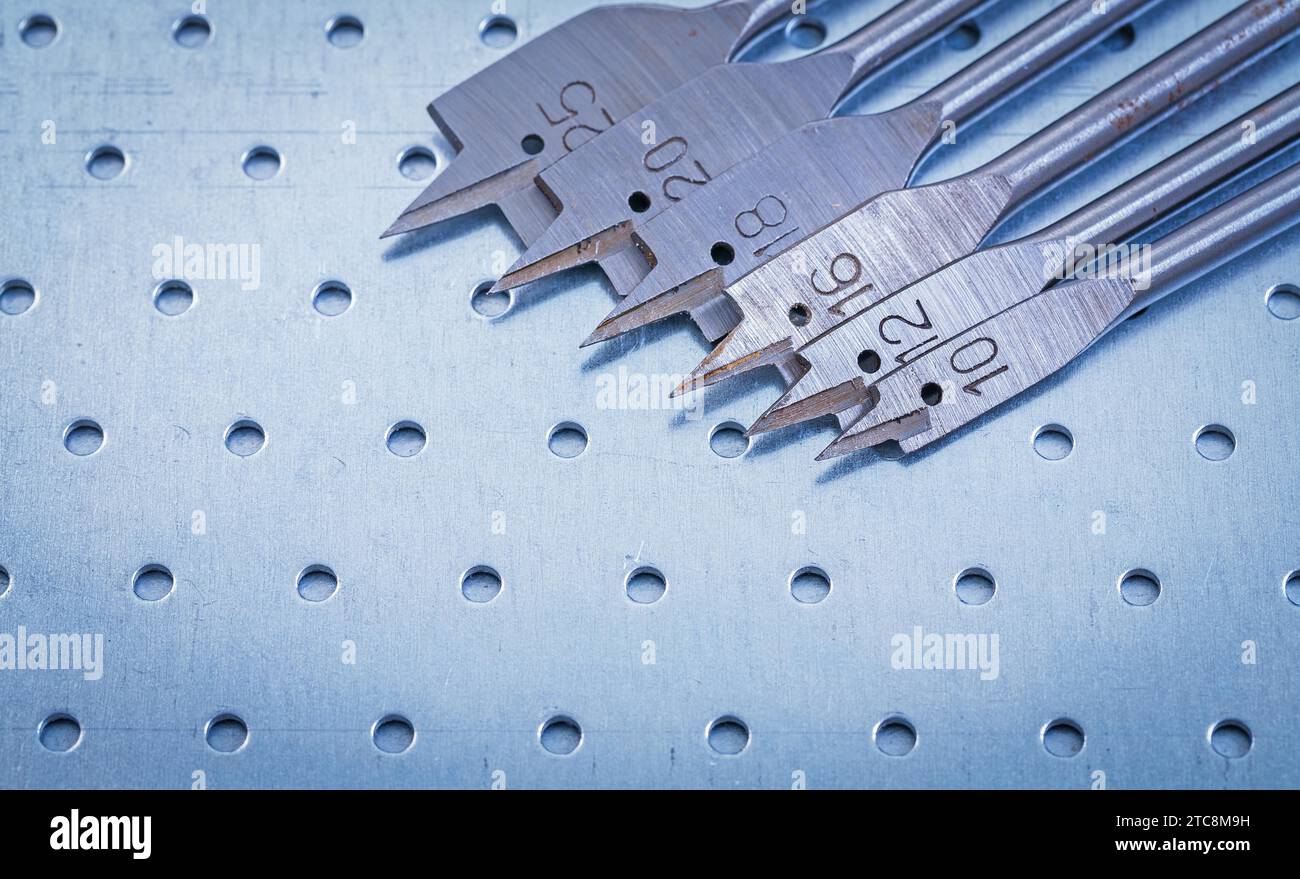 Spade bits for drilling wood on perforated metal sheet construction