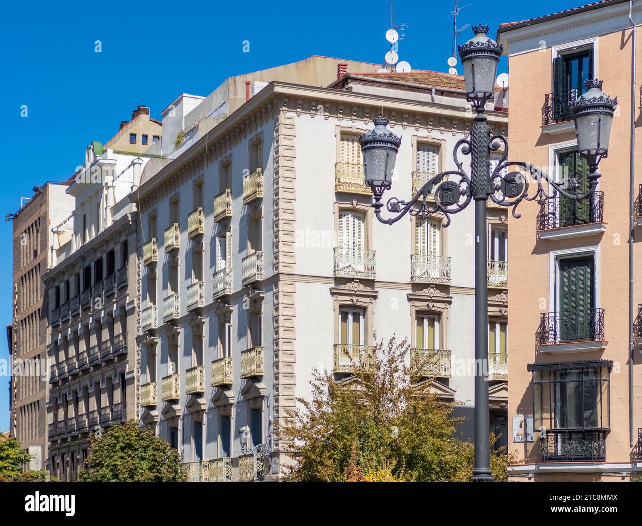 Old historic buildings surrounding the Plaza de Isabel II in downtown Madrid near the Madrid Opera house. Stock Photo