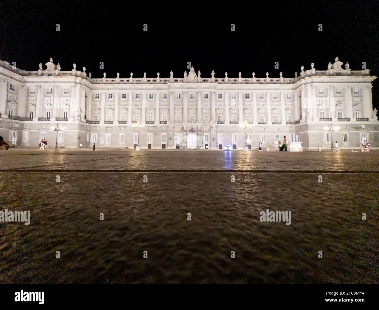 Exterior and courtyard of the historic Royal Palace in Madrid, Spain at night Stock Photo