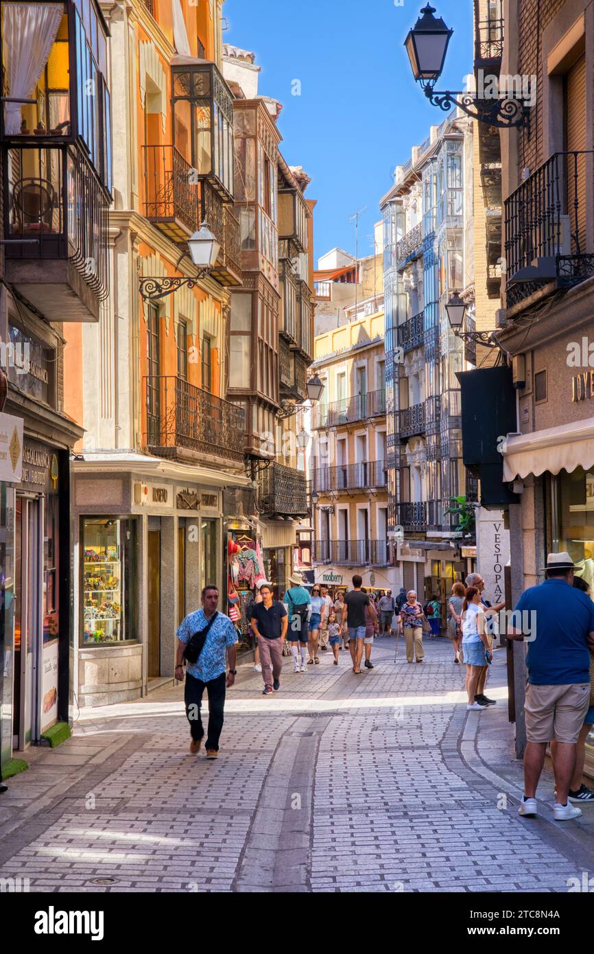 Toledo, Spain - August 29, 2023: Tourists walk along the old narrow streets of historic Toledo, Spain a UNESCO World Heritage Site Stock Photo